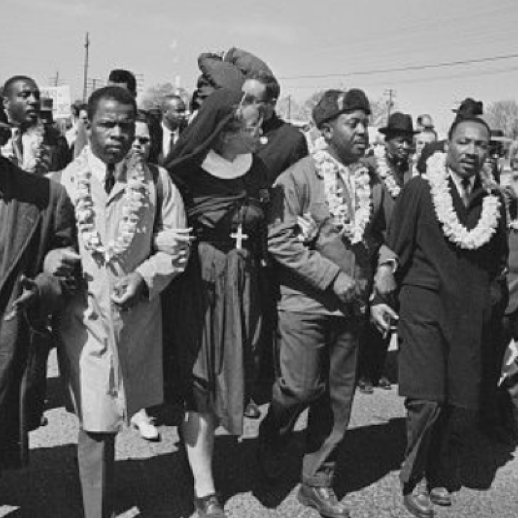 Flanked by the Rev. Ralph Abernathy and Rabbi Abraham Joshua Heschel, the Rev. Dr. Martin Luther King leads an interfaith march for voting rights in Selma, Alabama, on March 21, 1965. (Photo by William Lovelace/Daily Express/Hulton Archive/Getty Images)