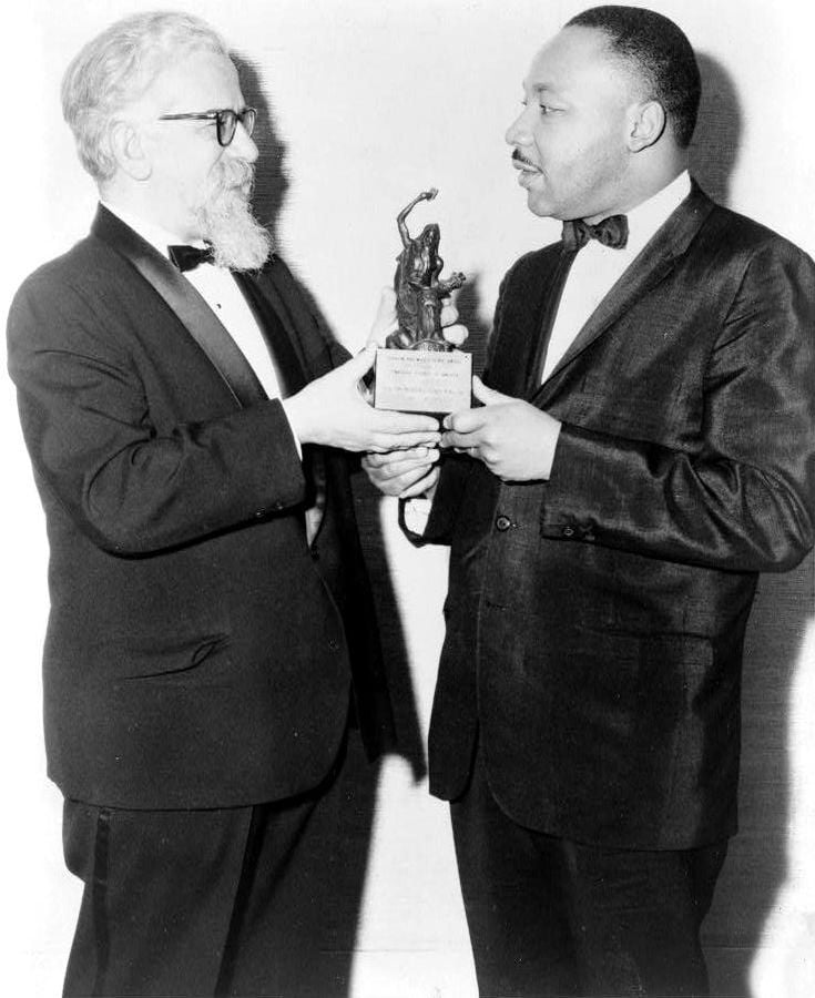 Rabbi Abraham Joshua Heschel, left, presenting the Rev. Martin Luther King Jr. with the Judaism and World Peace Award, December 1965. (Library of Congress)