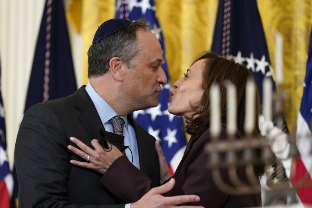 Vice President Kamala Harris and second gentleman Doug Emhoff kiss during an event in the East Room of the White House in Washington, to light the menorah to celebrate Hanukkah, Wednesday, Dec. 1, 2021. (AP Photo/Susan Walsh)