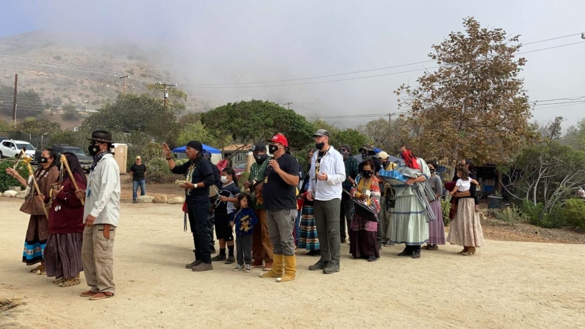 Apache Stronghold, a coalition of Apaches, other Native peoples and non-Native supporters seeking to preserve Oak Flat, arrives at Wishtoyo Chumash Village to begin a ceremonial circle, Sunday, Oct. 17, 2021, in in Malibu, California. RNS photo by Alejandra Molina.