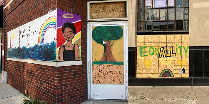 Paintings of love and equality on plywood walls around Kenosha, Wisconsin
