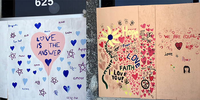 Messages of the power of love painted on plywood walls across Kenosha, Wisconsin