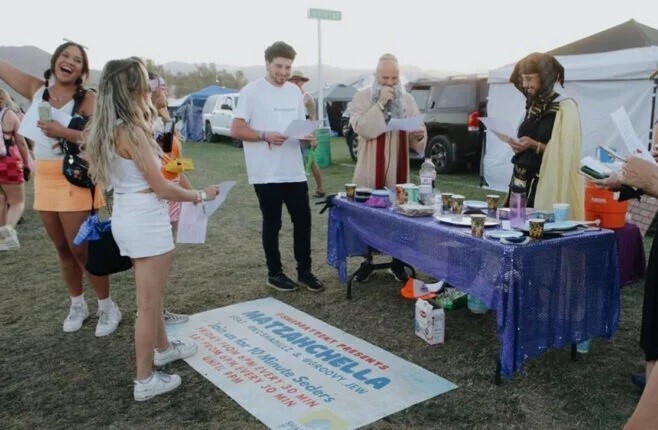 Rapper Kosha Dillz, center, dressed as Moses, leads Passover mini-Seders outside the Shabbat Tent at the Coachella music festival. Dillz refers to the event as Matzahchella. Photo via Instagram/@chrism_arts