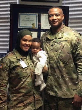 Army Colonel Khallid Shabazz, right, poses with SPC Savannah Spencer, who requested that Shabazz say a dua for her baby. Shabazz was Spencer’s division chaplain in the 7th Infantry Division. Photo courtesy of Khallid Shabazz