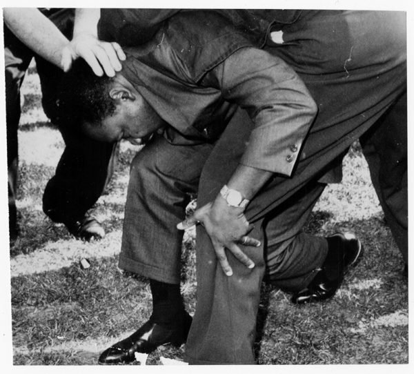 The Rev.. Martin Luther King Jr. is struck by a rock during a march in Chicago on Aug. 5, 1966. RNS archive photo