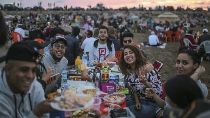 Friends pose for a photo as they prepare to break their fast on the beach in the holy month of Ramadan. (AP Photo/Mosa’ab Elshamy)