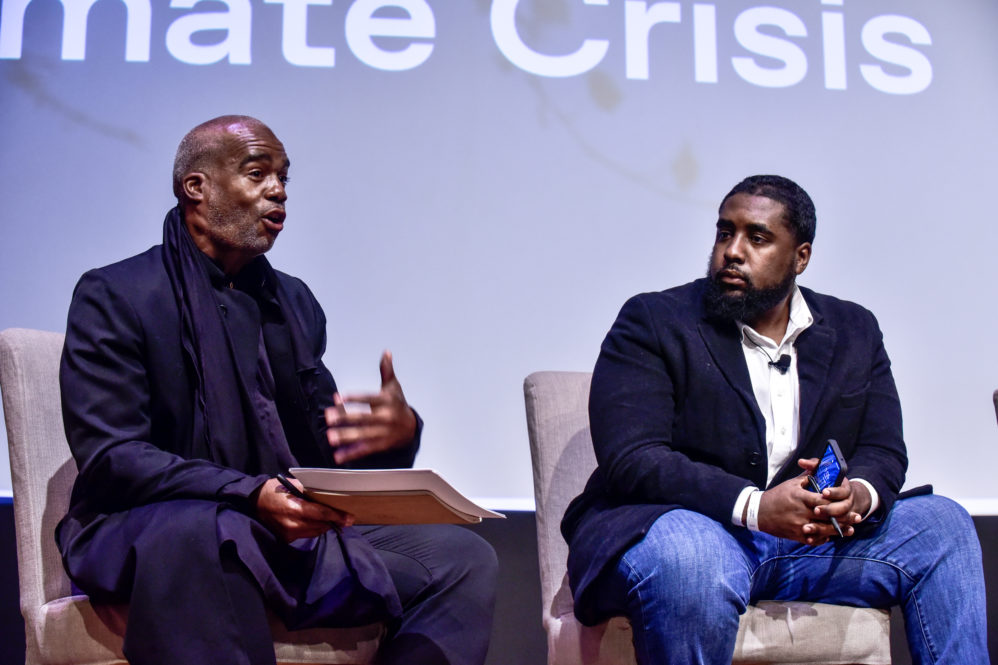 Ibrahim and William sitting on stage, in discussion