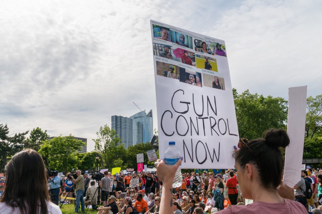 Boston, MA - June 11, 2022: March for Our Lives Protest Rally in Boston's Christopher Columbus Park in the North End. Protesters holding anti-gun signs calling for common sense gun legislation. (Heidi Besen/Shutterstock)