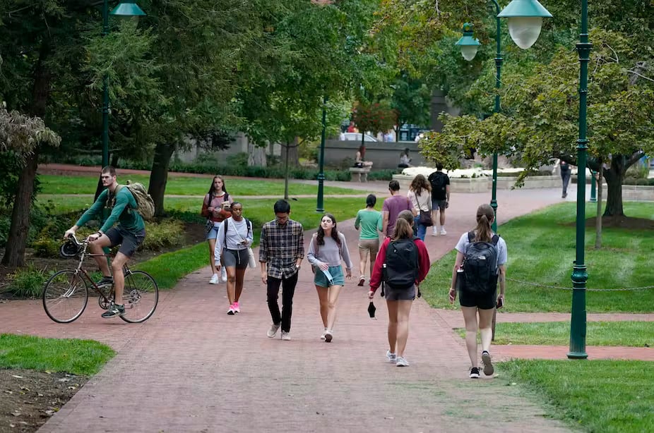 Do students’ views of people with different beliefs really change on campus? (AP Photo/Darron Cummings)