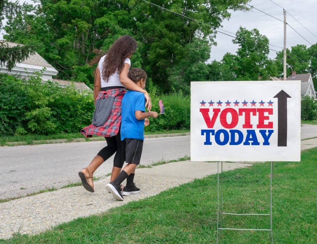 Mother and son going to vote. (cglade/Getty Images)