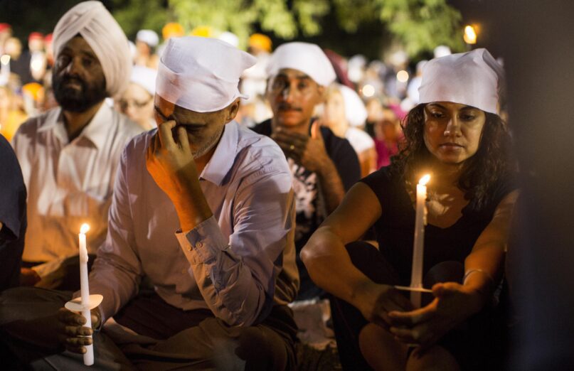 A candlelight vigil in Oak Creek for the victims of a mass shooting at the Sikh Temple of Wisconsin in August 2012. (AP Photo/Tom Lynn, File)