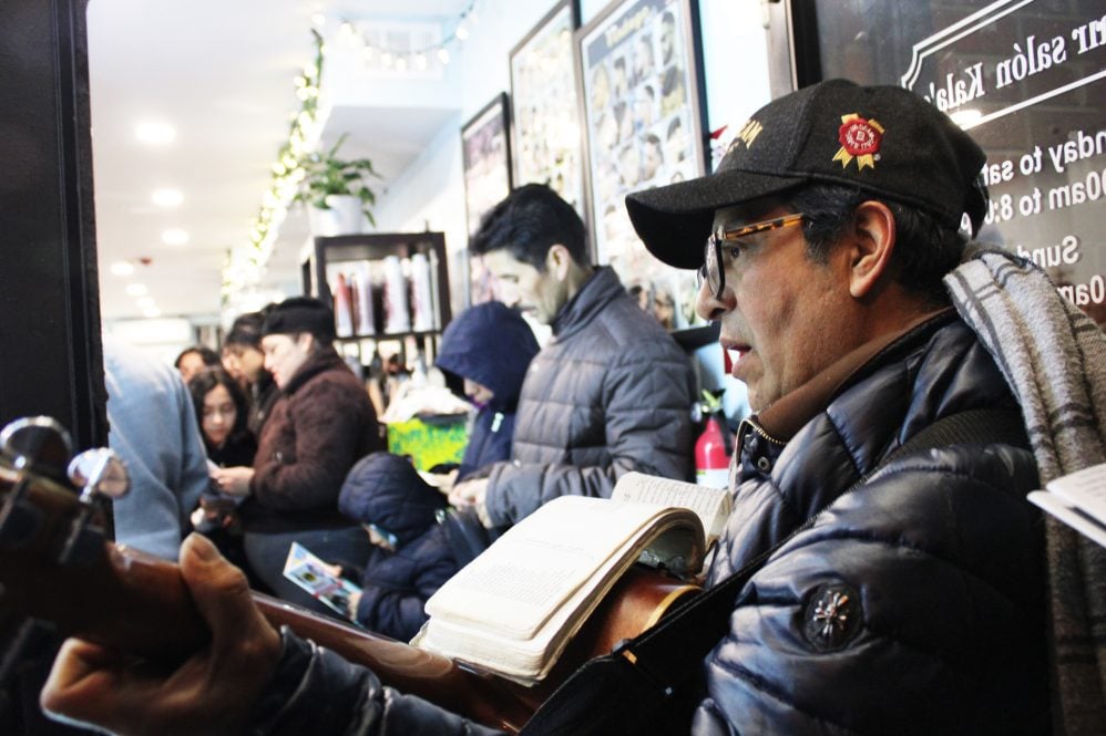Members of the congregation of Annunciation B.V.M. Catholic Church in South Philadelphia, along with other members of the community, gathered at Kala's Hair Salon on E. Passyunk Ave. to celebrate the tradition of las posadas on Dec. 19, 2022. RNS photo by Emily Neil