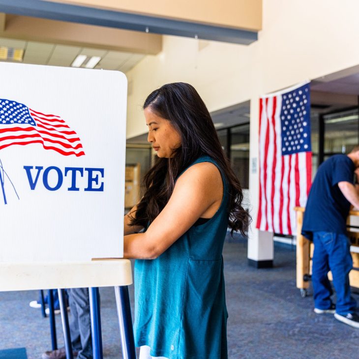 Americans voting in an election. (adamkaz/Getty Images)