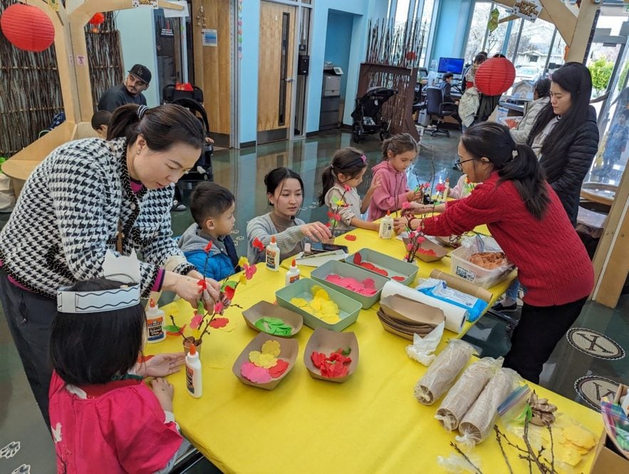 On Friday, February 2, Catholic Charities of Santa Clara hosted a Lunar New Year celebration for the Santee neighborhood community at the Center. Children made cherry blossoms with support from parents. (Courtesy Photo)