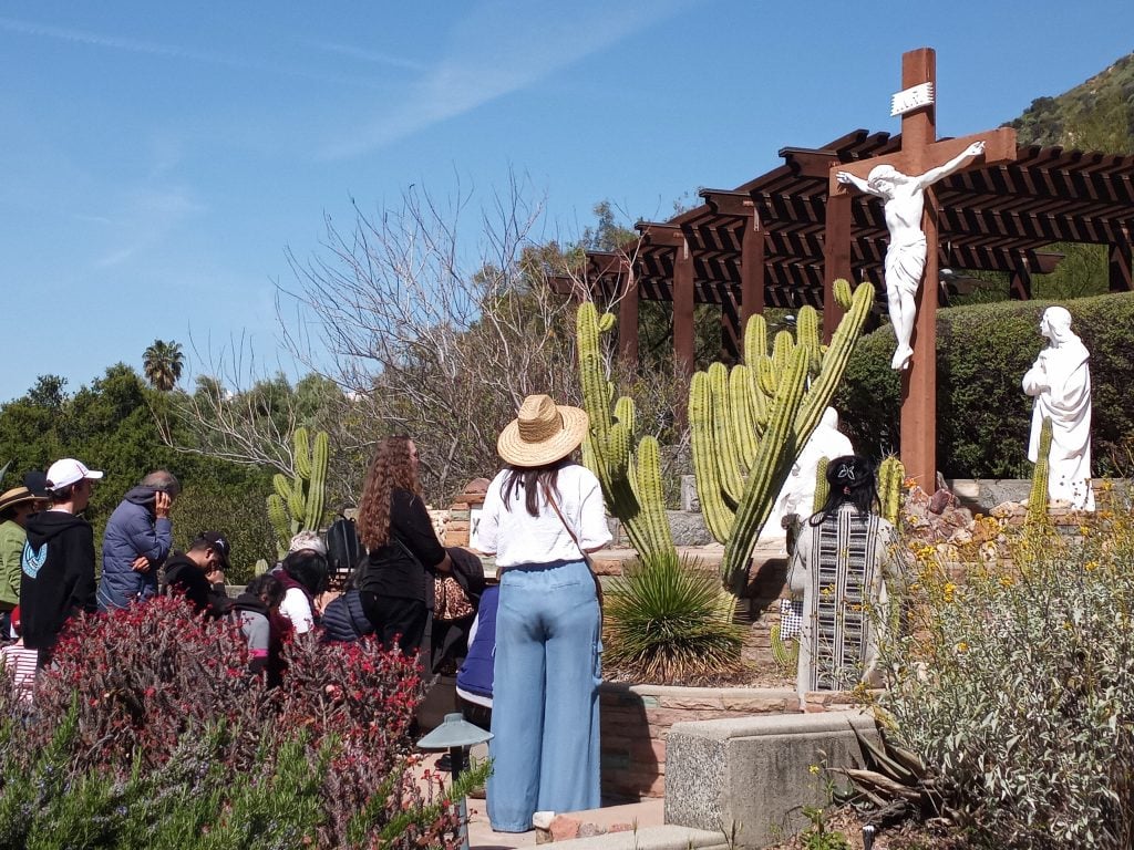 Christians reflecting on the crucifixion of Jesus at the Mater Dolorosa Passionist Retreat Center in Sierra Madre, California, in religious observance of Good Friday on April 7, 2023.