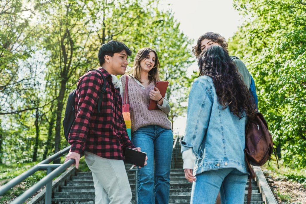 Conversations between friends on a college campus. (Giuseppe Lombardo/iStock/Getty Images Plus)