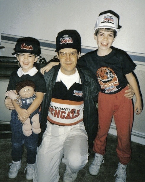 Adam Phillips poses with his sister and grandfather in Cincinnati Bengals gear.
