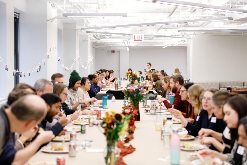 Interfaith America staff members enjoy each other's dishes at the annual Thanksgiving potluck. Photo by Kelly Feldmiller.