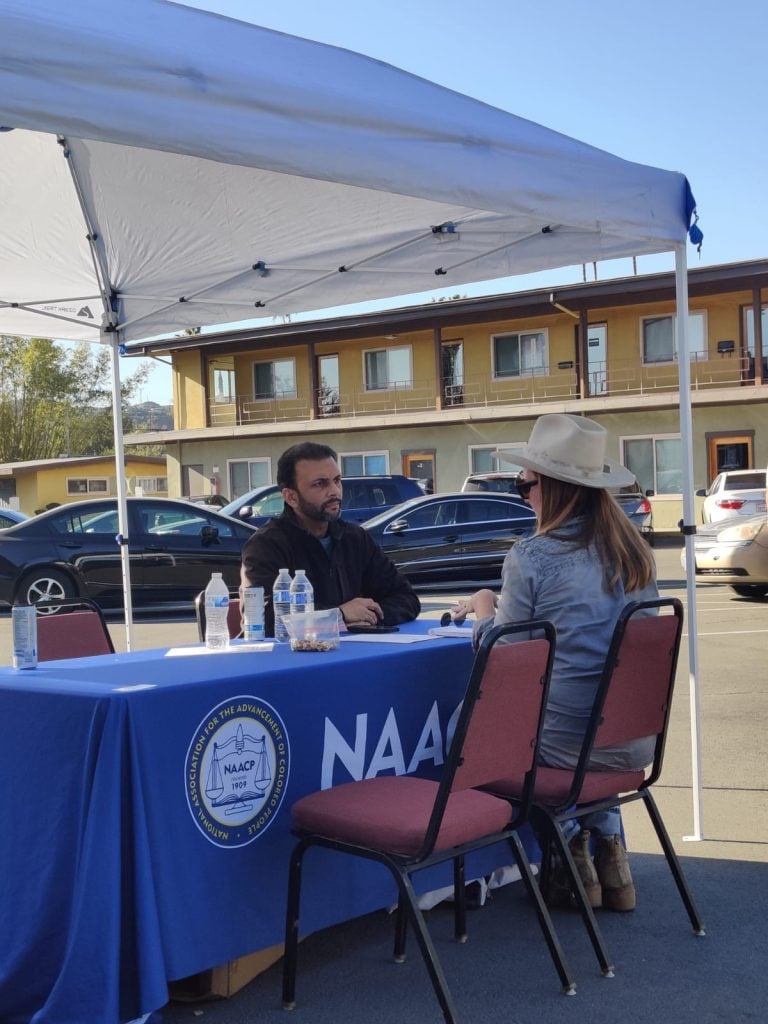 Qasim Rashid providing legal support for victims of the fires in Los Angeles. Services were a partnership between Humanity First USA and the NAACP of Pasadena. Photo courtesy of Qasim Rashid