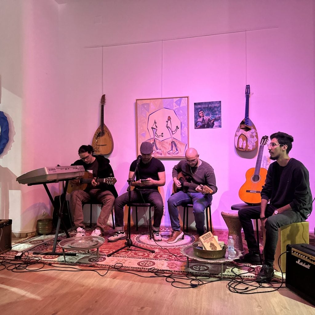 Akram Ghanemi, far right, plays Chaabi music with three other young Algerian musicians at El Medrab gallery during Ramadan, March 1, 2025, in Algiers, Algeria. (Photo by Audrey Thibert for RNS).