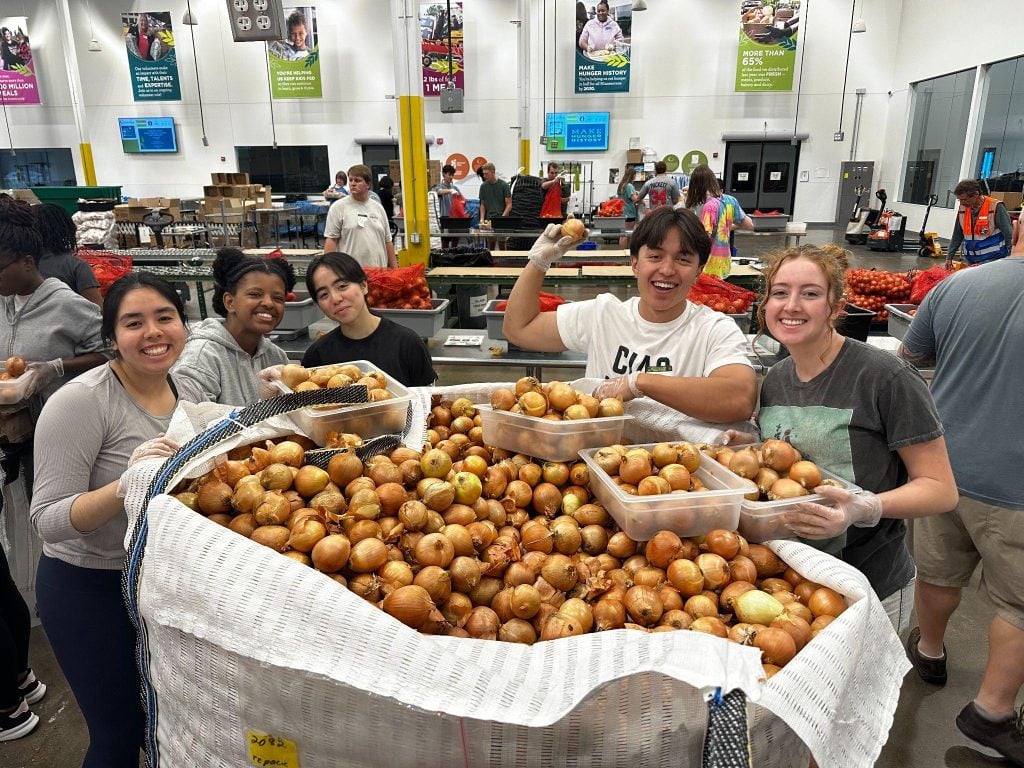 University of St. Thomas students serve at Second Harvest Heartland.