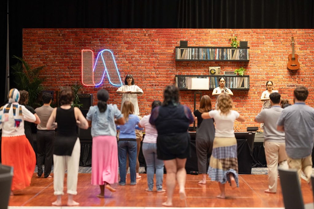 Harmeet Kaur Kamboj instructs participants in a a session called "Interfaith Intersections in South Asian Diasporic Dance."
