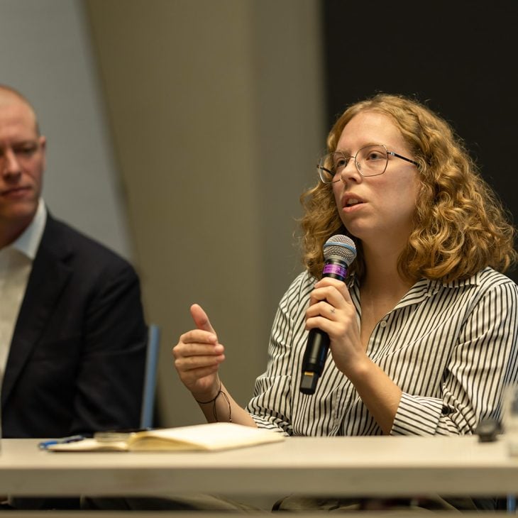 Jax Collins speaks on the "Navigating Faith in the Workplace" panel at the 2025 Interfaith Leadership Summit.