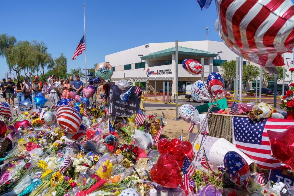 Phoenix, Arizona - September 13, 2025: Memorial and vigil outside the Turning Point USA Headquarters, after Charlie Kirk was killed fatally shot while speaking at Utah Valley University in Orem, Utah. (Shutterstock/melissamn)