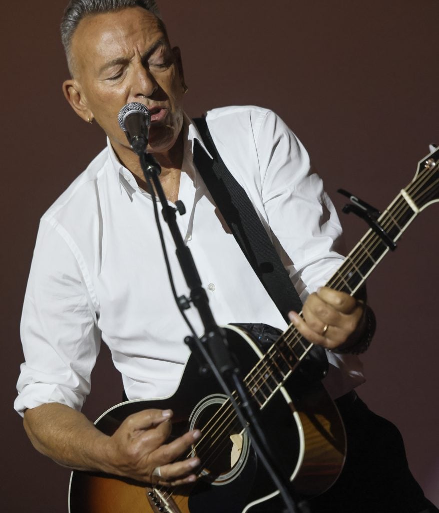 HOLLYWOOD, CALIFORNIA - OCTOBER 22: Bruce Springsteen performs at the AFI FEST 2025 Presented By Canva Opening Night "Springsteen: Deliver Me From Nowhere" Premiere at TCL Chinese Theatre on October 22, 2025 in Hollywood, California. (Photo by Rodin Eckenroth/Getty Images for AFI)