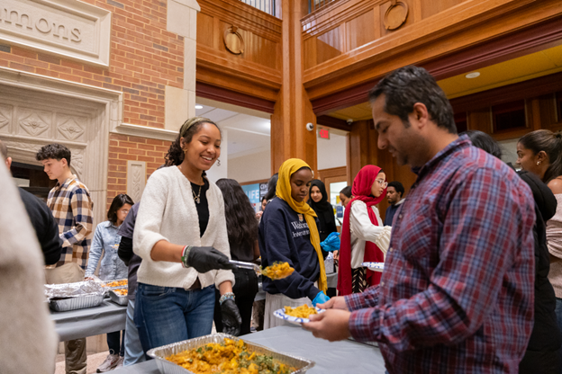 Students serve their peers at the interfaith iftar. Photo credit: Yiwen Zha 