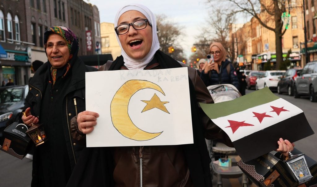 NEW YORK, NEW YORK - FEBRUARY 28: People participate in a Ramadan parade on Fifth Avenue in the Bay Ridge neighborhood on February 28, 2025 in the Brooklyn borough in New York City. Members of the Muslim community began to observe the start Ramadan this evening with a parade. Ramadan is a sacred month of fasting, prayer, and reflection and commemorates the revelation of the Quran to the Prophet Muhammad. It is celebrated by Muslims throughout the world.  (Photo by Michael M. Santiago/Getty Images)
