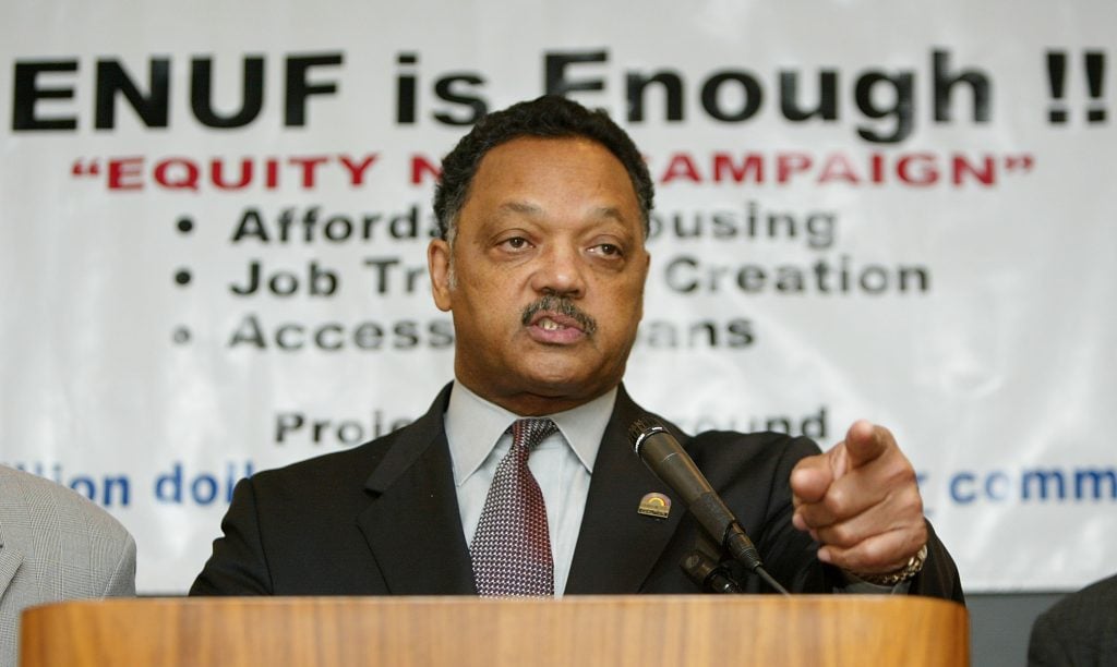 NEW YORK - APRIL 15: Rev. Jesse Jackson speaks at a news conference at the New York Federal Reserve after testifying at a public hearing on the proposed merger between JPMorganChase and Bank One April 15, 2004 in New York City. Jackson called for additional hearings about whether the merger will adversely affect minority and poor communities. (Photo by Mario Tama/Getty Images)