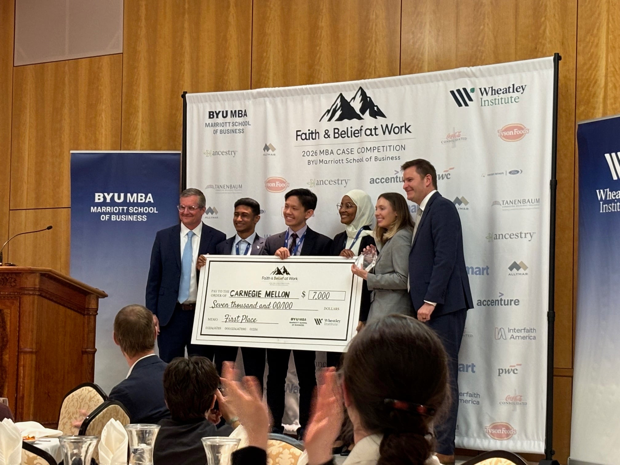 First-place winners from Carnegie Mellon University accept their prize at the case competition’s closing dinner. (Photo credit: Harmeet Kaur Kamboj)