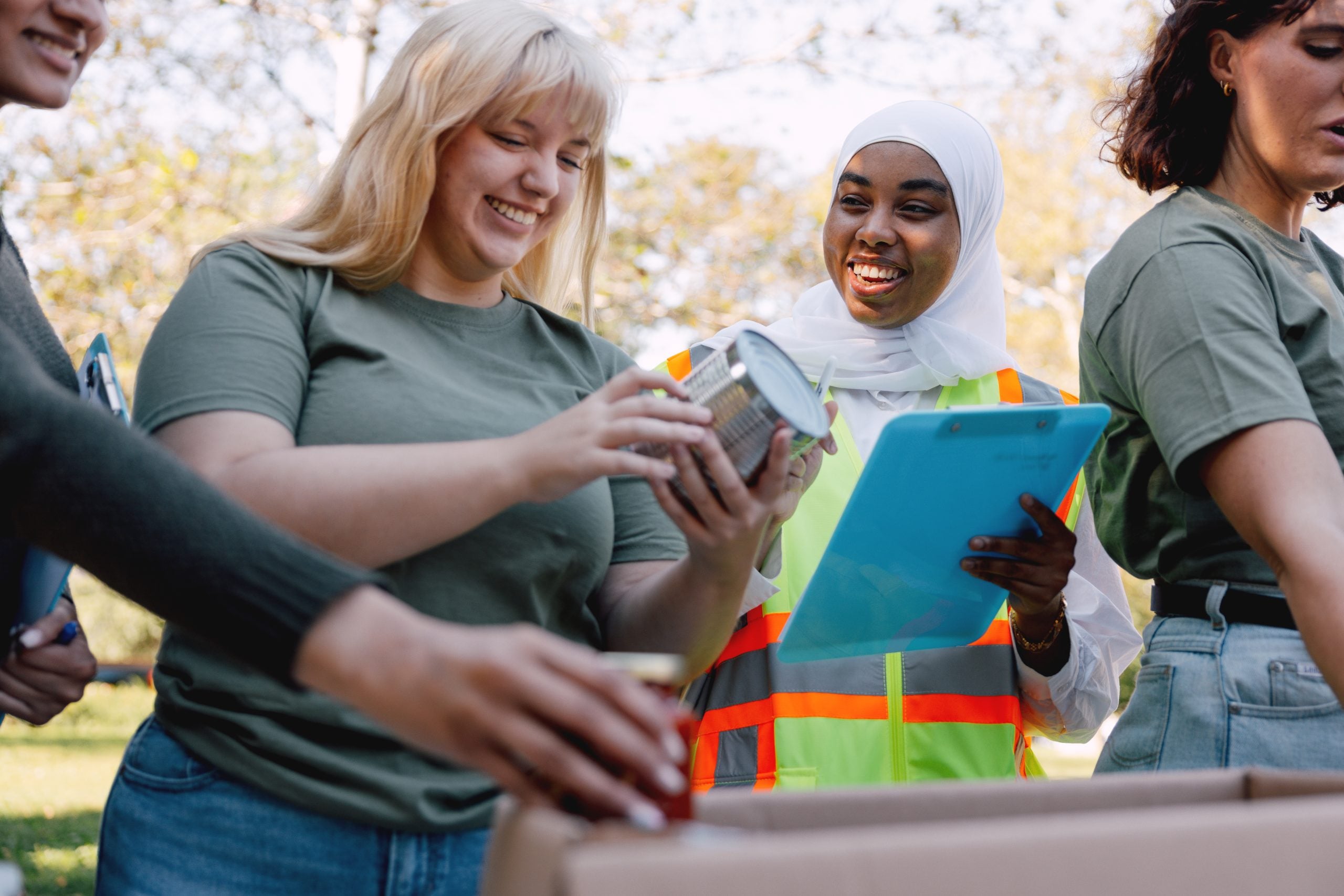 Charitable foundation giving their help in a New York City neighborhood, collecting food and clothes.