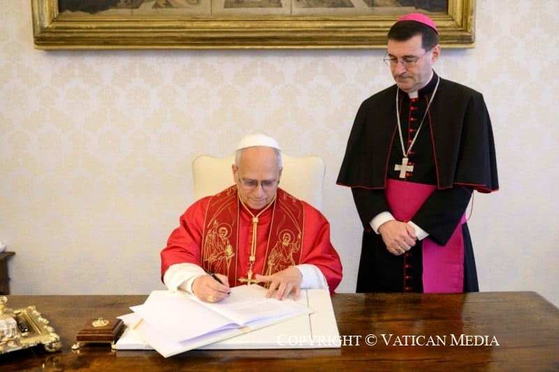 The signing of the First Encyclical Letter of His Holiness Leo XIV Magnifica Humanitas. (Copyright © Dicastery for Communication - Vatican Media)