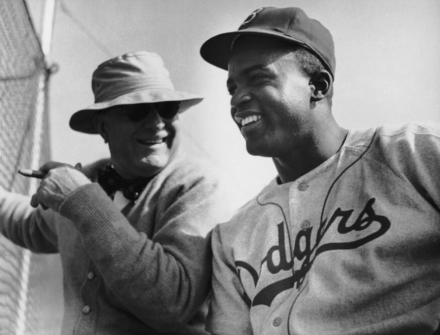 Brooklyn Dodgers President Branch Rickey talking to his second sacker Jackie Robinson at a team training camp in Vero Beach, Florida, 17th March 1949. (Photo by Curt Gunther/Keystone/Archive Photos/Getty Images)