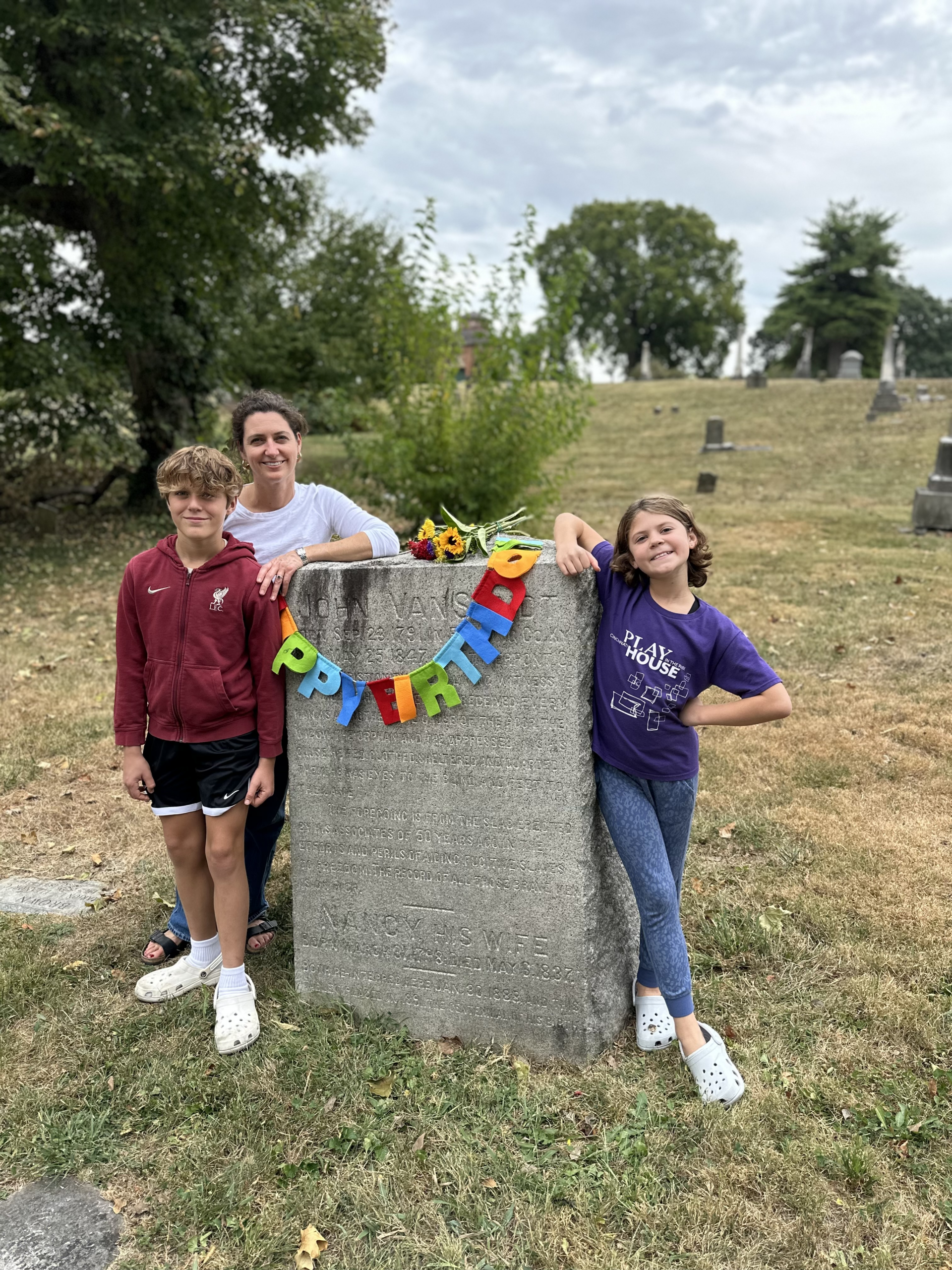Megan Johnson (center) and her kids visit John Van Zandt's gravesite in Cincinnati, Ohio. Photo courtesy