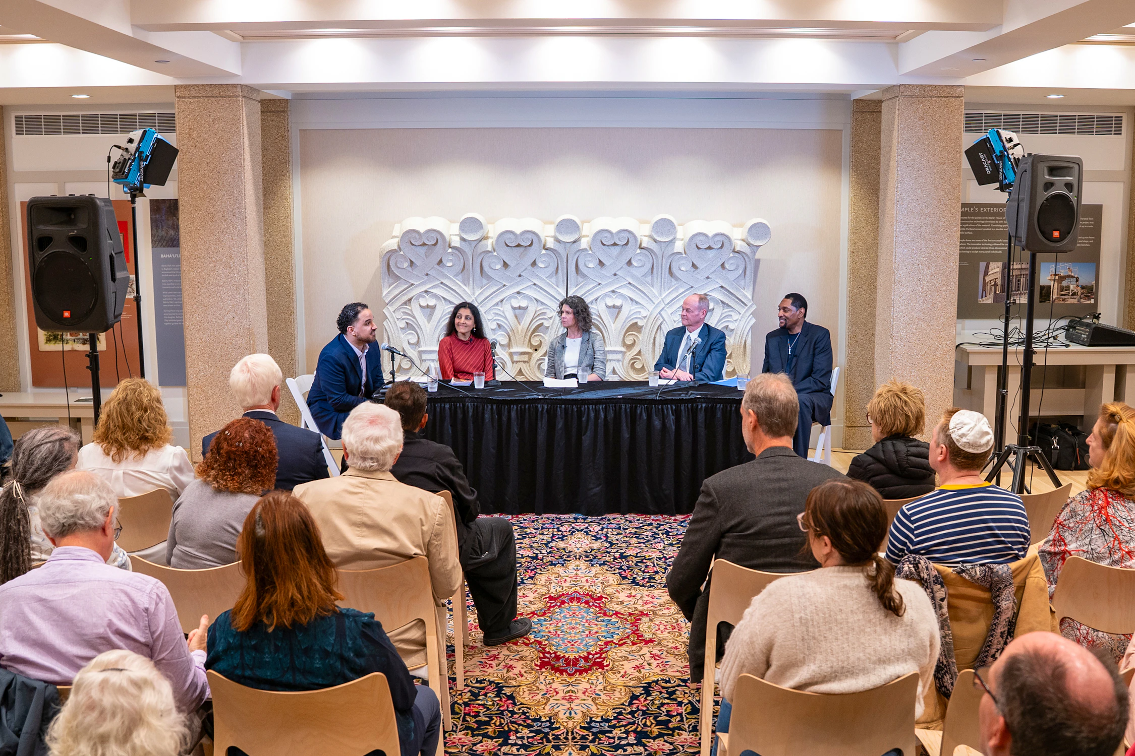 Katie Bringman Baxter, Chief impact Officer and COO for Interfaith America (center) on a panel conversation, "A Conversation about Spiritual Renewal in the Life of the Nation" at the Bahá’í House of Worship in Wilmette., IL, on May 24, 2026.  Photo courtesy of Bahá’í World News Service.