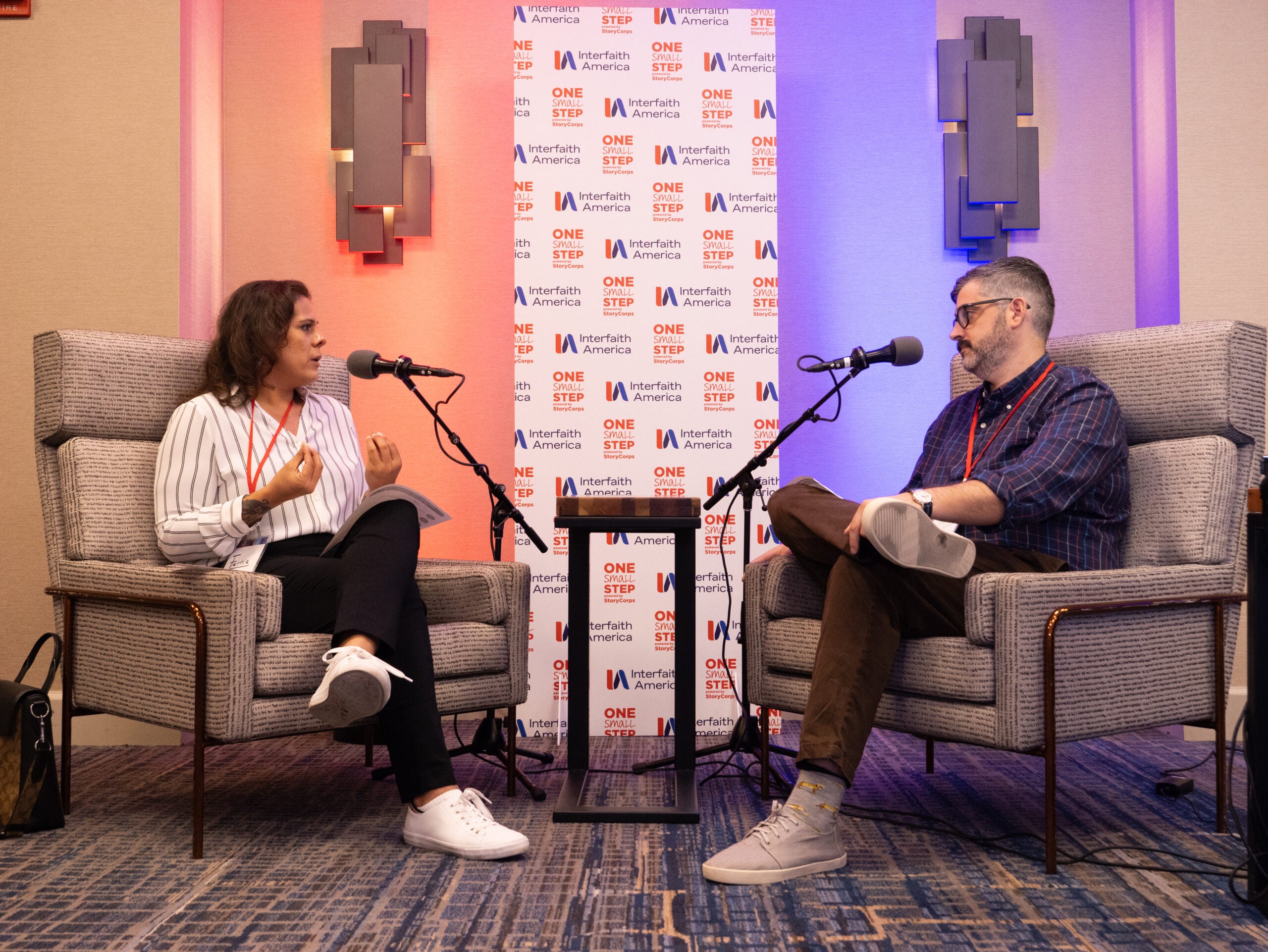 Dr. Fernie Rodriguez (left) and Matt Hoffman (right) at the StoryCorps conversation at the 2025 Interfaith Leadership Summit in Chicago, Illinois. (Alex Myung)