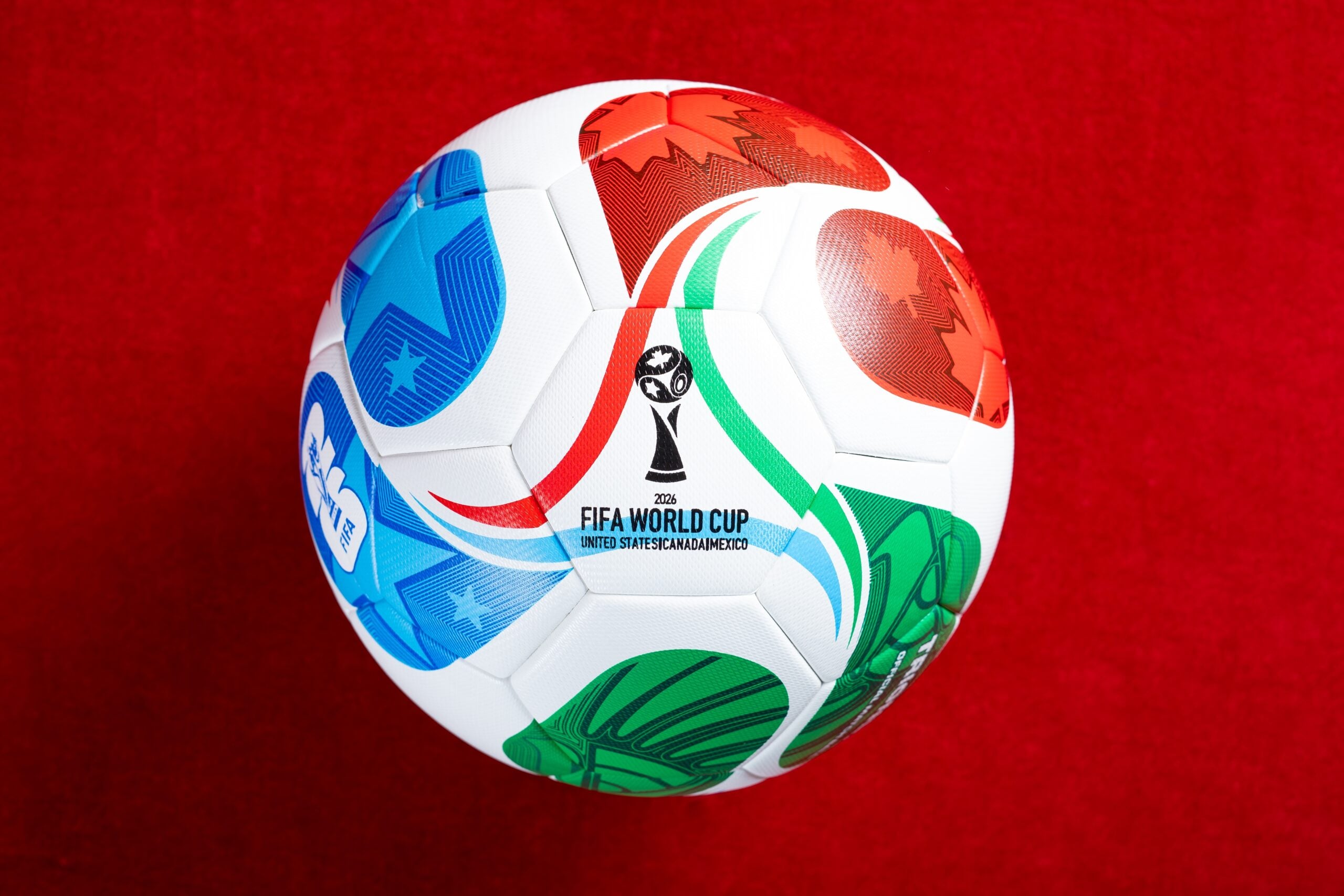 ZHONGSHAN China-July 18 2025: top view 2026 World Cup soccer on red at horizontal composition (Shutterstock)