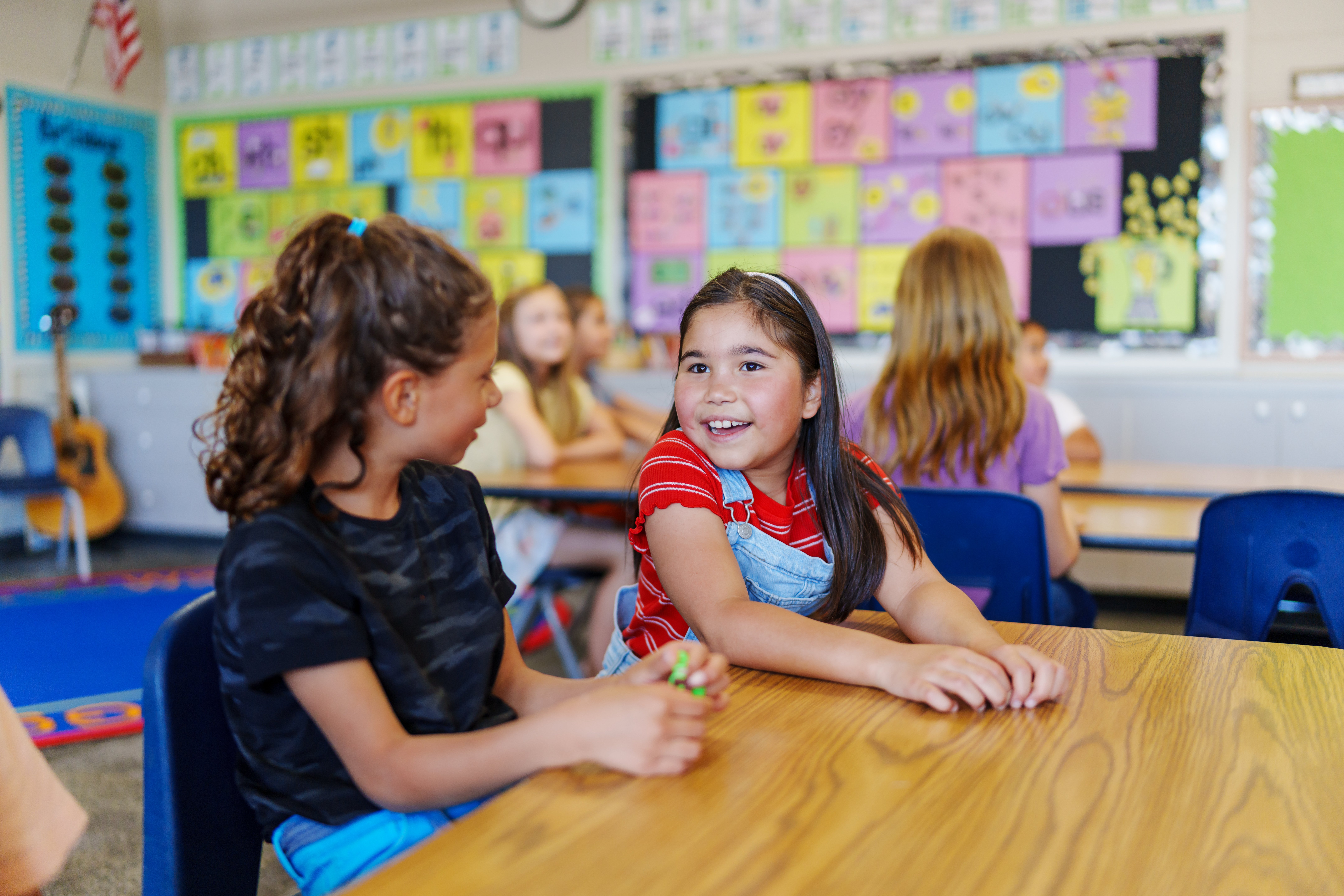 Students talking together at school. (Fly View Productions/Getty Images)