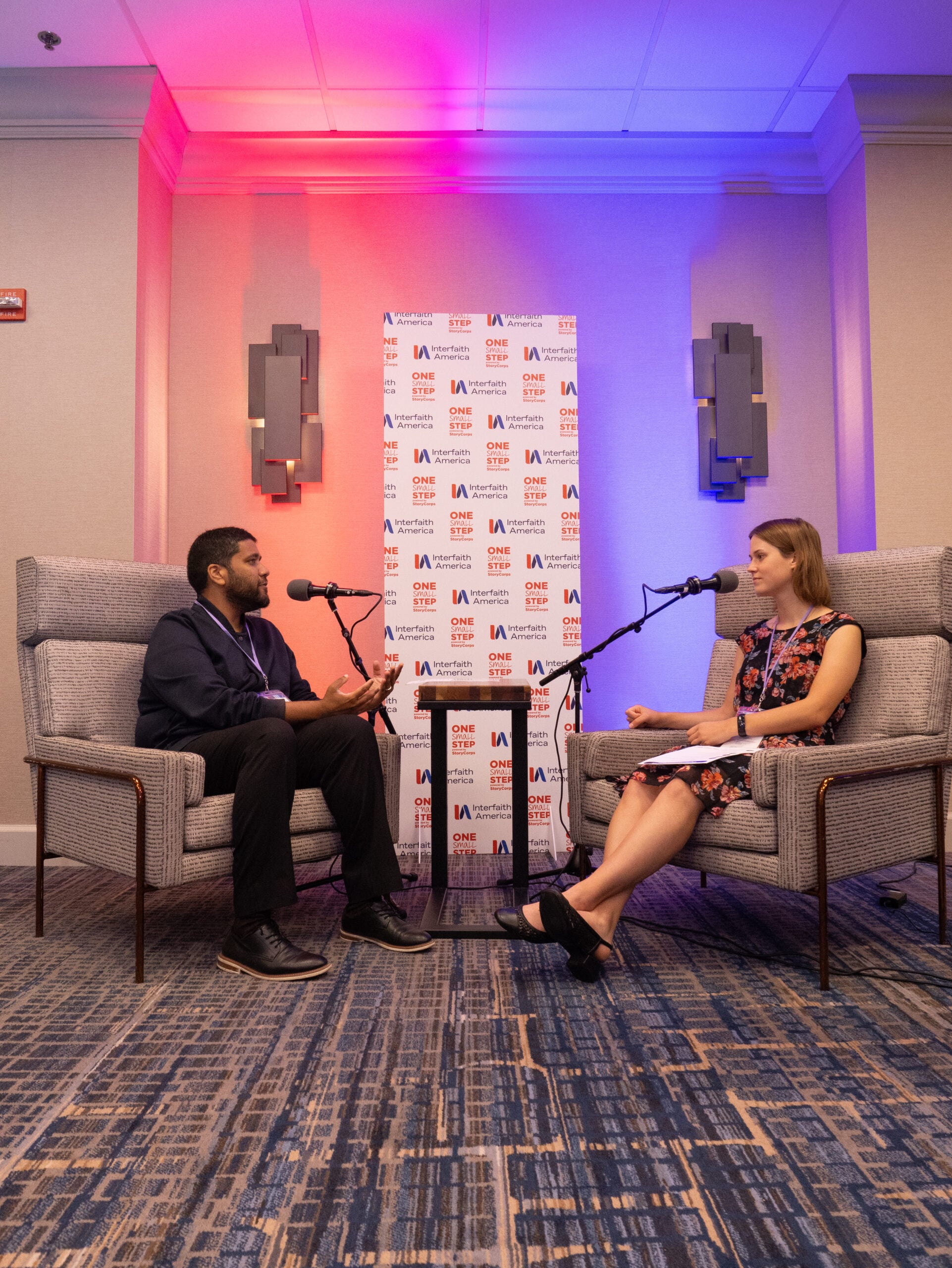 Reaz Khan (left) and Meg Huber (right) at their StoryCorps conversation at the 2025 Interfaith Leadership Summit in Chicago, Illinois. (Alex Myung)