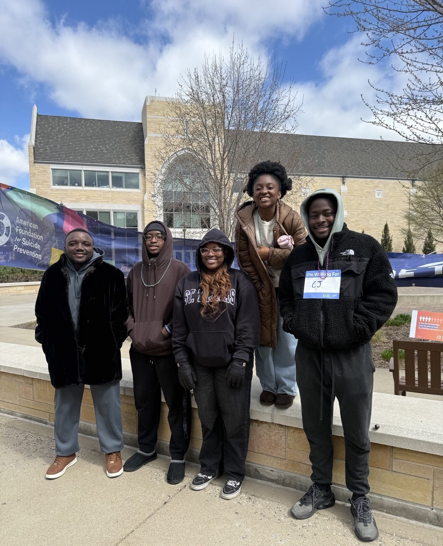 ﻿Participants walking along Summit Avenue during the Out of the Darkness Campus Walk.
Photo credit: Kelly Odiakosa