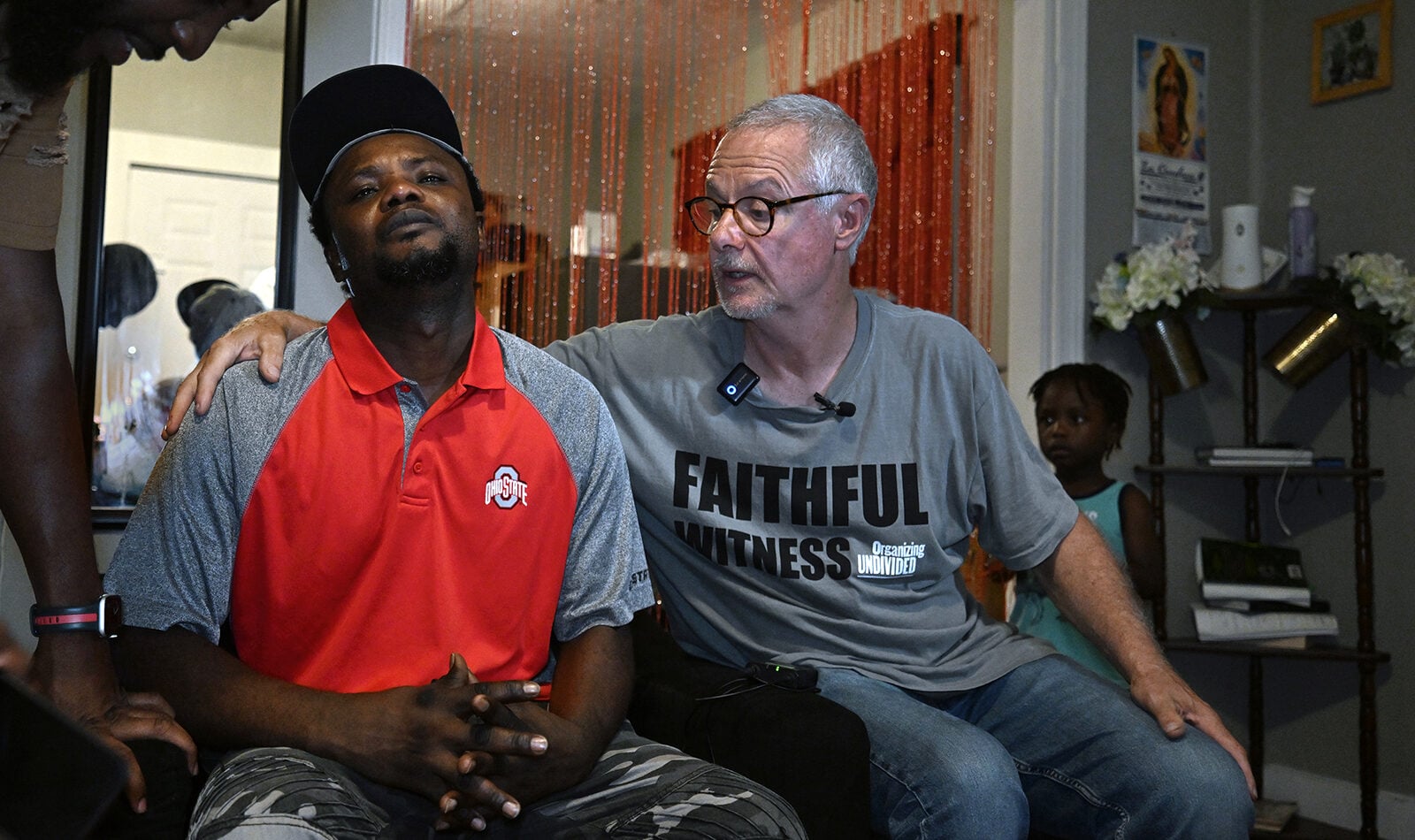 Pastor Carl Ruby, right, comforts Pierre Ronal Bel after the death of his son, Pierre Demas Bel, 20, on Aug. 31, 2026, in Springfield, Ohio. (RNS photo/Carol Guzy)