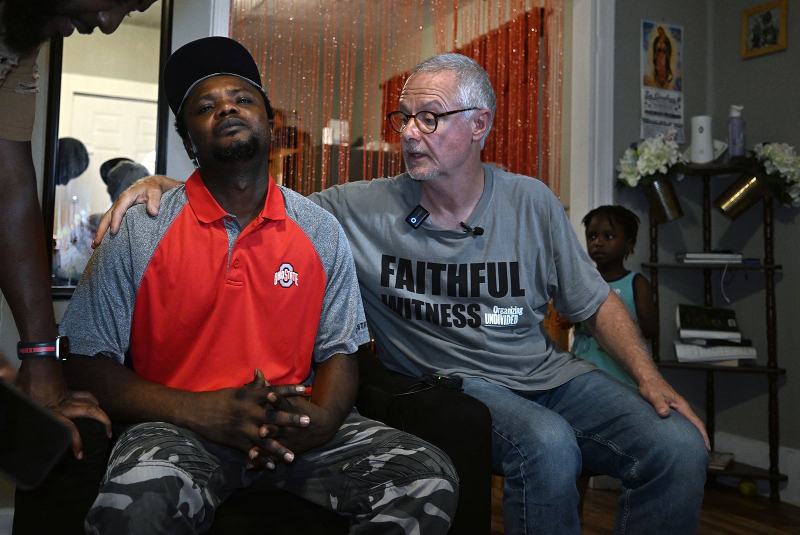 Pastor Carl Ruby, right, comforts Pierre Ronal Bel after the death of his son, Pierre Demas Bel, 20, on Aug. 31, 2026, in Springfield, Ohio. (RNS photo/Carol Guzy)