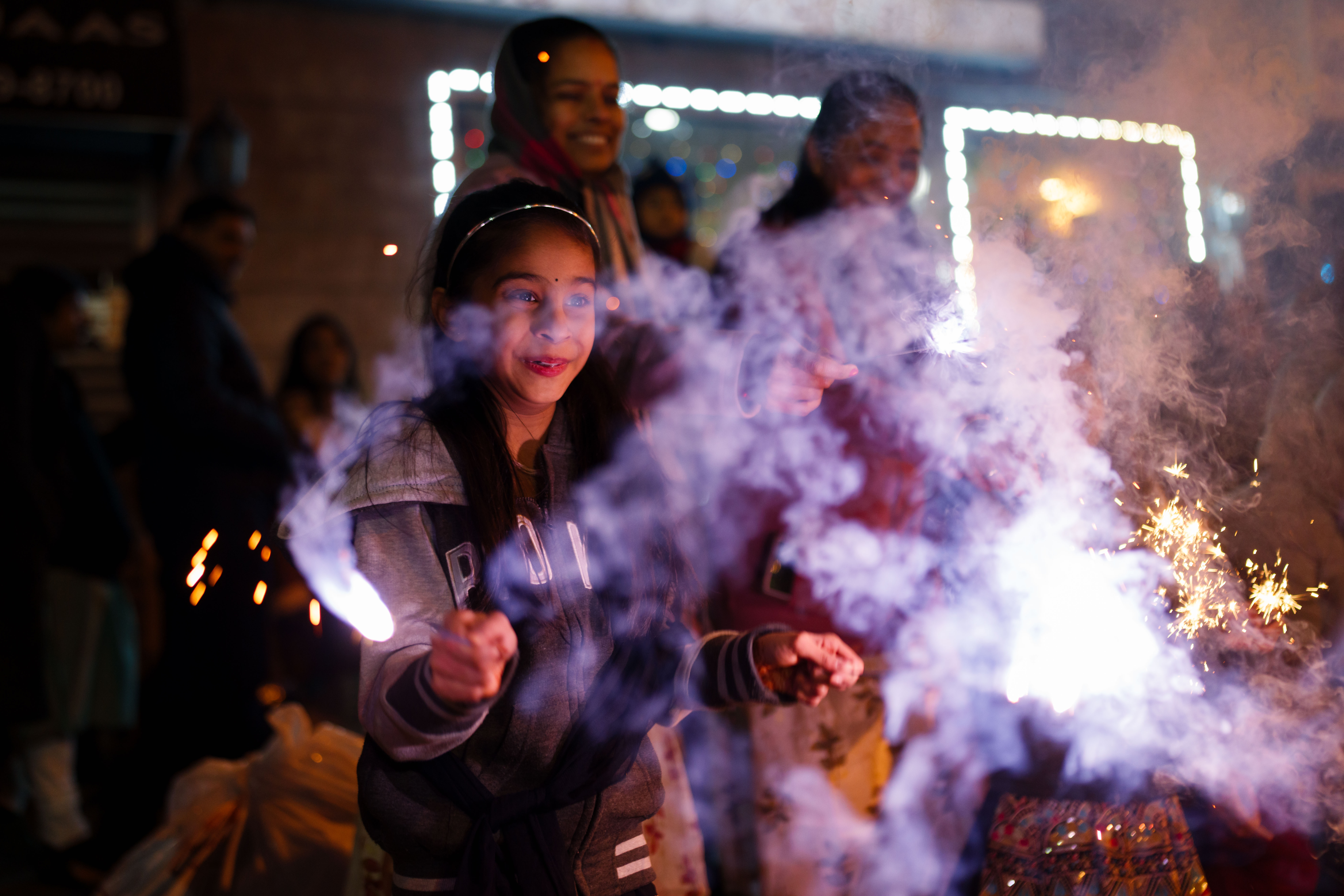 JERSEY CITY, NEW JERSEY - NOVEMBER 12: A girl holds a sparkler as they celebrate Diwali on November 12, 2023 in Jersey City, New Jersey. Diwali, also known as Deepavali, or the ''festival of lights'', is a popular Hindu festival that symbolizes the spiritual "victory of light over darkness, good over evil, and knowledge over ignorance." (Photo by Adam Gray/Getty Images)