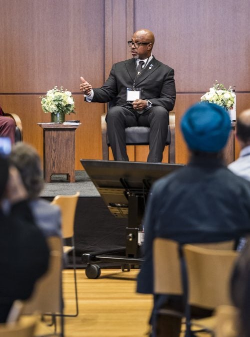 The Rev. Eric Manning, center, speaks on a panel with Rabbi Hazzan Jeffrey Myers, right, moderated by the Rev. Jacqui Lewis, left, during the 2025 RNS symposium at Trinity Commons, Wednesday, Oct. 22, 2025, in New York City. (Photo by Kisha Bari)