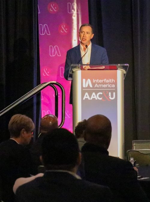 Todd Green, director of campus partnerships at Interfaith America, welcomes over 150 attendees to the Advancing Campus Pluralism convening. Photo by Silma Suba