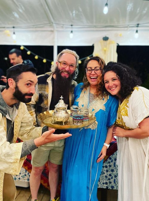Merav Fine Braun (right) with husband (left) and friends at the family Mimouna. Photo courtesy
