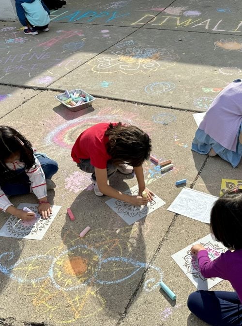 Diwali rangoli chalk art as an optional recess activity outside of a school. (Courtesy Photo from Smita Garg)